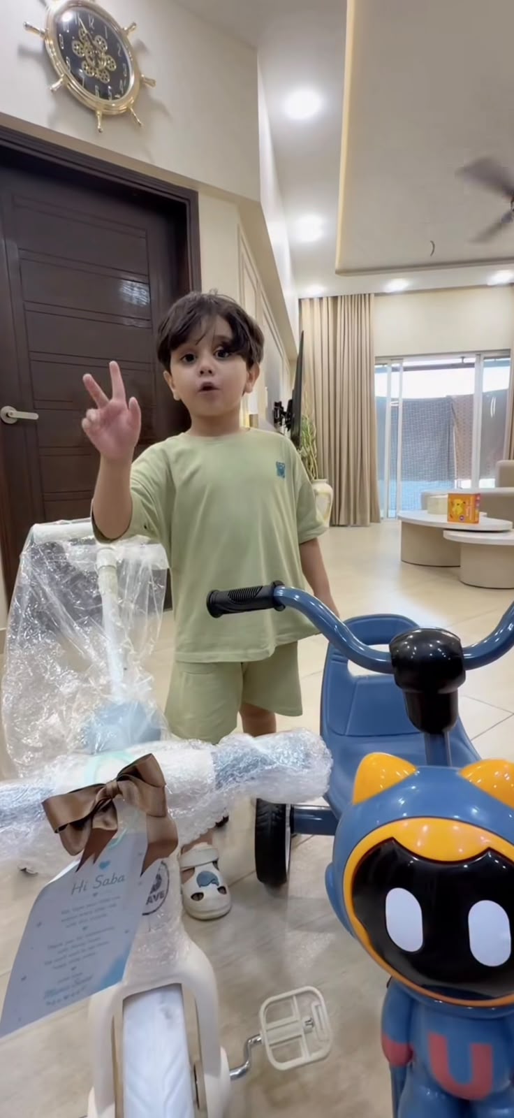 Happy customer unboxing the Robo Rider tricycle at home